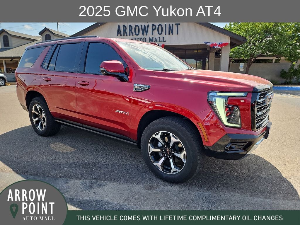 2025 GMC Yukon AT4 in Volcanic Red Tintcoat — front three-quarter view